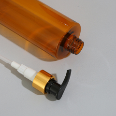 light resistant amber color cosmetic bottle with pump and cap gold